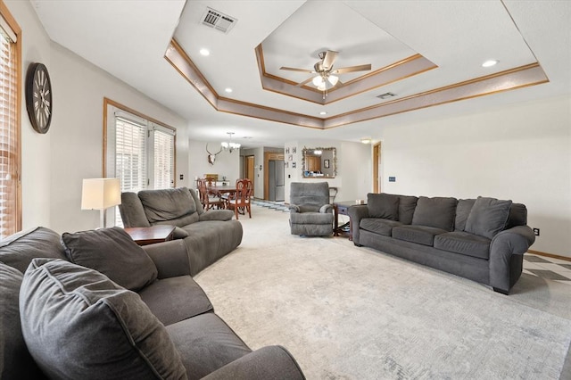 910796 S 3350th Rd, Wellston, OK 74881 - carpeted living area featuring a raised ceiling, a ceiling fan, recessed lighting, and a chandelier