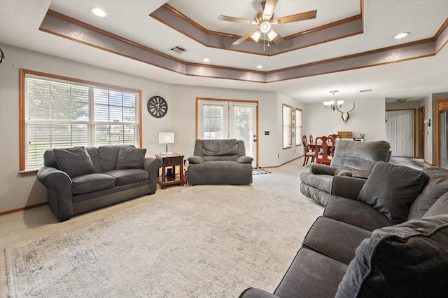 910796 S 3350th Rd, Wellston, OK 74881 - living room with a raised ceiling, carpet flooring, a chandelier, ornamental molding, and ceiling fan