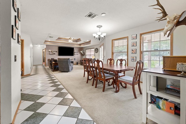 910796 S 3350th Rd, Wellston, OK 74881 - dining area featuring light colored carpet, a raised ceiling, a chandelier, a ceiling fan, and light tile patterned floors