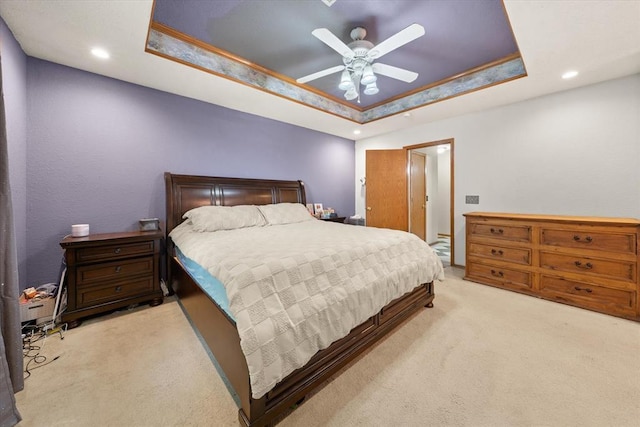 910796 S 3350th Rd, Wellston, OK 74881 - bedroom with a tray ceiling, light carpet, recessed lighting, and a ceiling fan