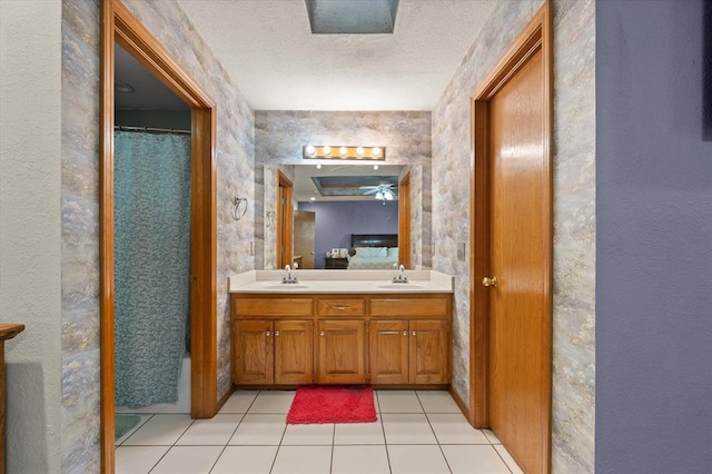 910796 S 3350th Rd, Wellston, OK 74881 - full bath with double vanity, a textured ceiling, tile patterned flooring, and curtained shower