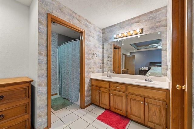 910796 S 3350th Rd, Wellston, OK 74881 - full bathroom featuring double vanity, tile patterned flooring, a tray ceiling, and curtained shower