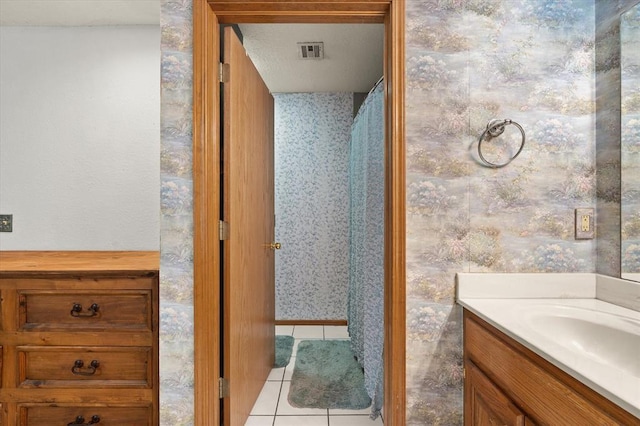 910796 S 3350th Rd, Wellston, OK 74881 - full bath featuring tile patterned floors, vanity, wallpapered walls, and curtained shower