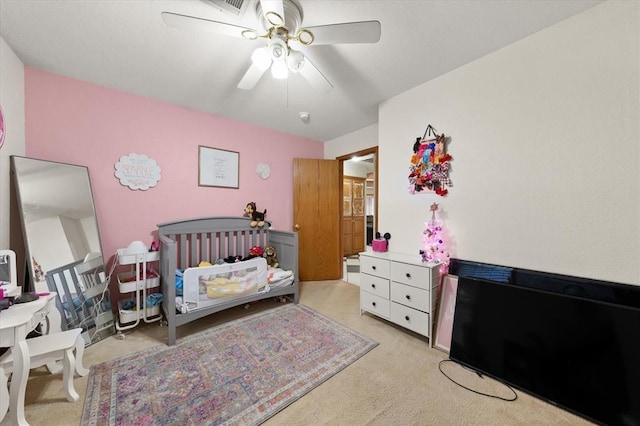 910796 S 3350th Rd, Wellston, OK 74881 - bedroom with light colored carpet and ceiling fan