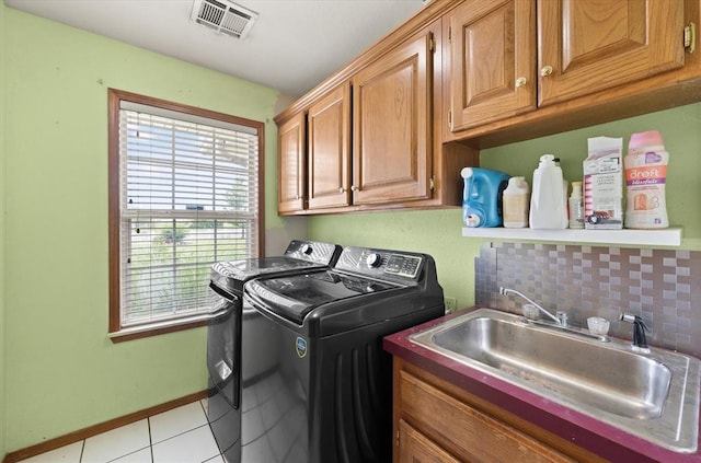 910796 S 3350th Rd, Wellston, OK 74881 - laundry area with independent washer and dryer, cabinet space, and light tile patterned floors