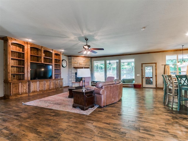 12905 S Mustang Rd, Mustang, OK 73064 - living area with ceiling fan, dark wood-style flooring, plenty of natural light, and crown molding