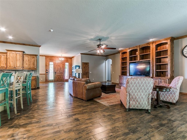 12905 S Mustang Rd, Mustang, OK 73064 - living area featuring ornamental molding, dark wood-style floors, ceiling fan, a textured ceiling, and a chandelier