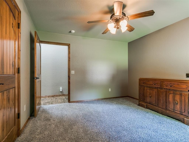 12905 S Mustang Rd, Mustang, OK 73064 - unfurnished bedroom featuring light carpet and a ceiling fan