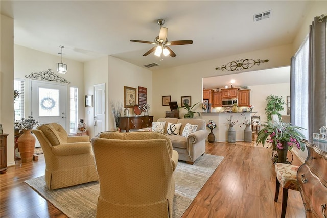 2221 NW 158th St, Edmond, OK 73013 - living area with light wood-style flooring and a ceiling fan