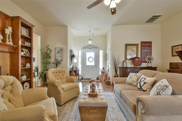 2221 NW 158th St, Edmond, OK 73013 - living room with ceiling fan and wood finished floors