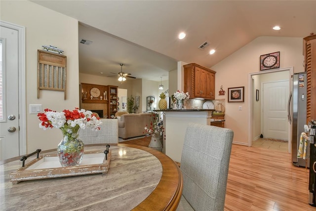 2221 NW 158th St, Edmond, OK 73013 - dining space with light wood-type flooring, lofted ceiling, ceiling fan, and recessed lighting
