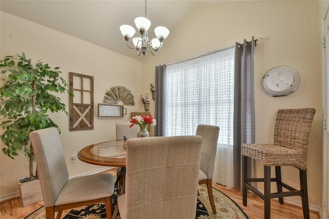 2221 NW 158th St, Edmond, OK 73013 - dining space featuring a chandelier, healthy amount of natural light, light wood-style floors, and lofted ceiling