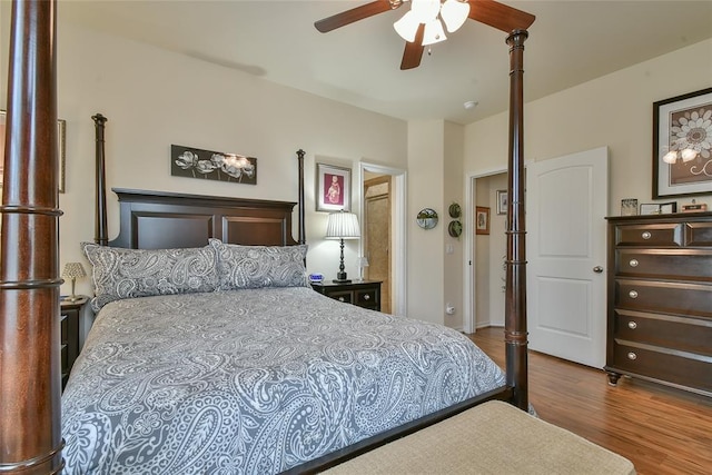 2221 NW 158th St, Edmond, OK 73013 - bedroom featuring wood finished floors and a ceiling fan