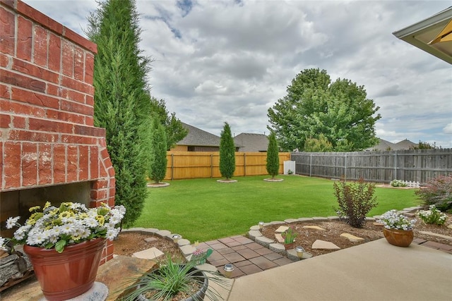 2221 NW 158th St, Edmond, OK 73013 - fenced backyard with a patio area