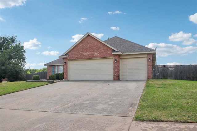 4605 Mackenzie Dr, Moore, OK 73160 - ranch-style house featuring brick siding, a garage, driveway, and roof with shingles