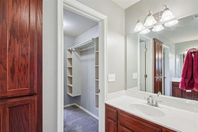 4605 Mackenzie Dr, Moore, OK 73160 - bathroom with vanity and a closet