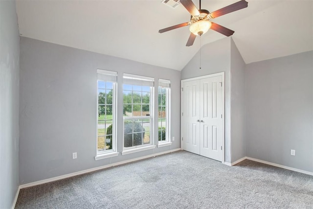 4605 Mackenzie Dr, Moore, OK 73160 - unfurnished bedroom with carpet flooring, lofted ceiling, a closet, and a ceiling fan