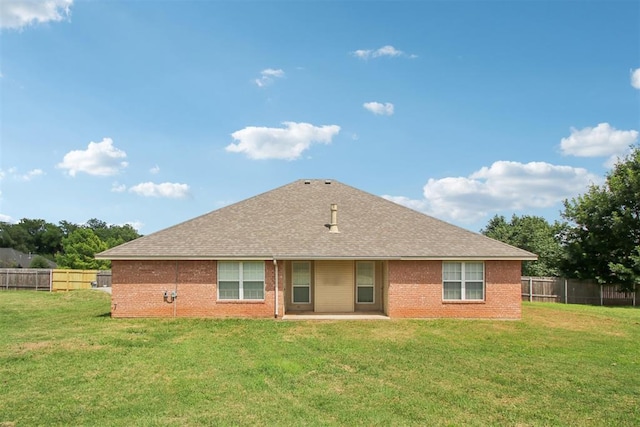 4605 Mackenzie Dr, Moore, OK 73160 - back of property featuring a fenced backyard, a shingled roof, brick siding, and a patio
