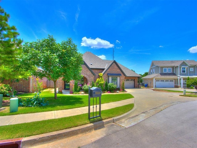 3508 Pavilion Pl, Edmond, OK 73034 - view of front facade with concrete driveway, a front lawn, and brick siding