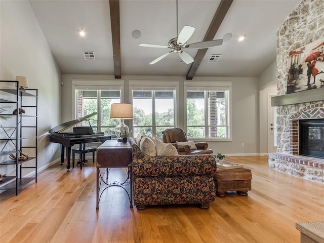3508 Pavilion Pl, Edmond, OK 73034 - living area featuring wood finished floors, ceiling fan, and a fireplace