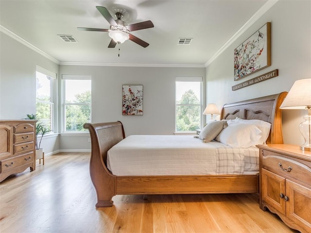 3508 Pavilion Pl, Edmond, OK 73034 - bedroom featuring light wood-style flooring, ornamental molding, and a ceiling fan