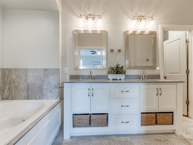3508 Pavilion Pl, Edmond, OK 73034 - bathroom featuring double vanity, a jetted tub, and a ceiling fan