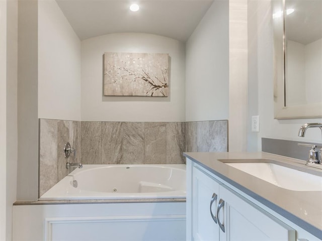3508 Pavilion Pl, Edmond, OK 73034 - full bathroom featuring vanity, a jetted tub, and recessed lighting