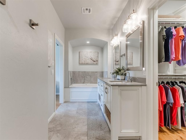 3508 Pavilion Pl, Edmond, OK 73034 - full bath with double vanity, a bath, and a walk in closet