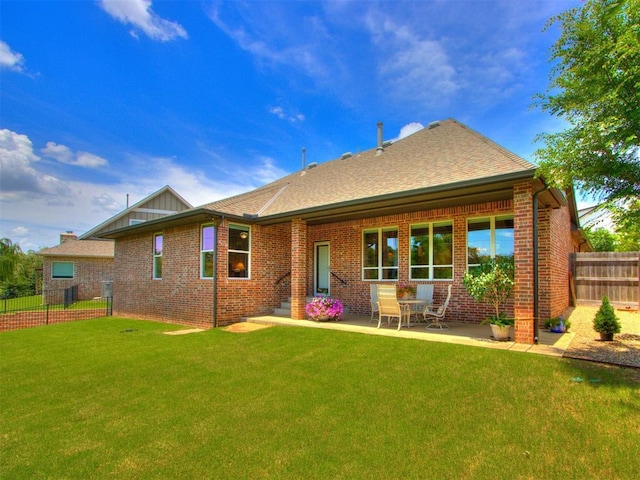 3508 Pavilion Pl, Edmond, OK 73034 - back of property featuring brick siding, a shingled roof, and a patio area