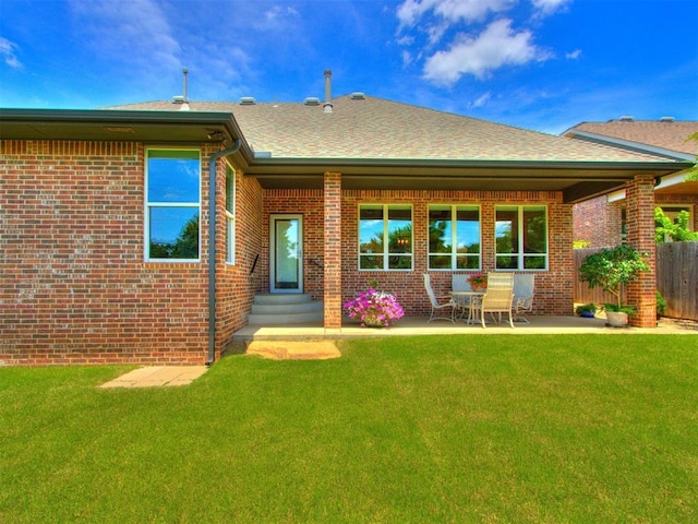 3508 Pavilion Pl, Edmond, OK 73034 - rear view of property featuring brick siding, entry steps, roof with shingles, and a patio