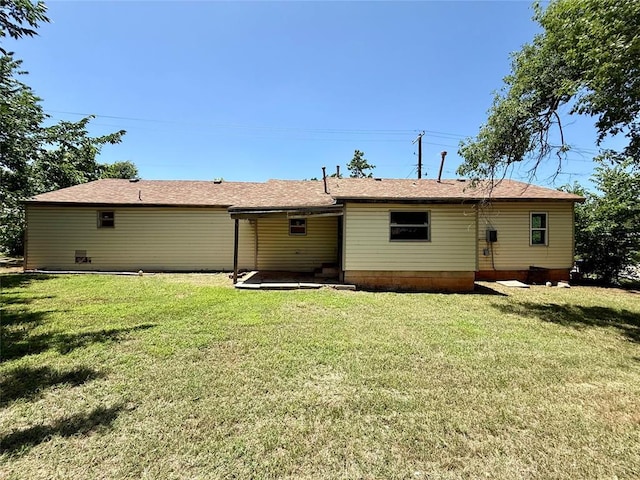 2918 N Prospect Ave, Oklahoma City, OK 73111 - rear view of house featuring a lawn