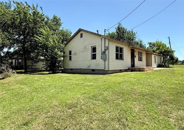 2918 N Prospect Ave, Oklahoma City, OK 73111 - view of property exterior featuring a yard and crawl space