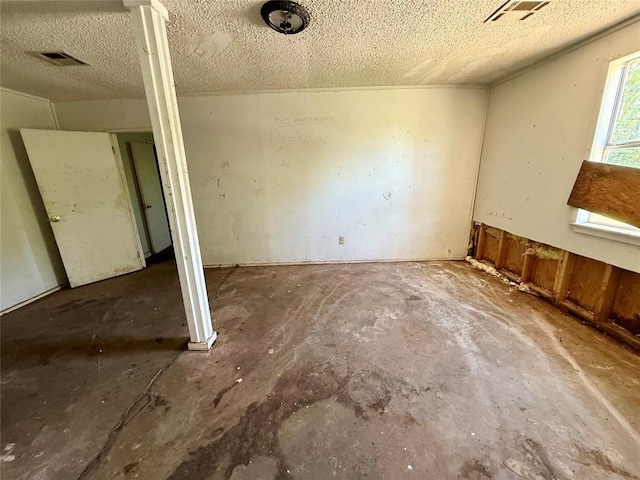 2918 N Prospect Ave, Oklahoma City, OK 73111 - unfurnished bedroom featuring unfinished concrete flooring and a textured ceiling
