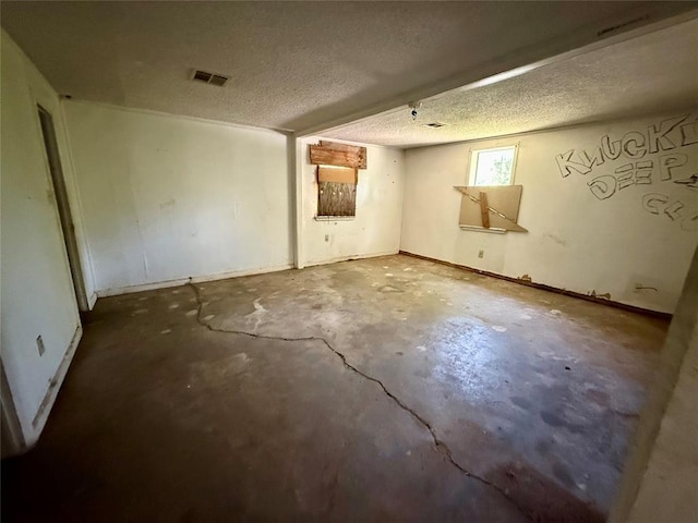 2918 N Prospect Ave, Oklahoma City, OK 73111 - empty room with concrete flooring and a textured ceiling
