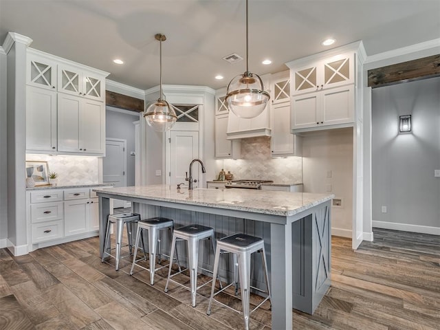 4821 Hidalgo Ave, Mustang, OK 73064 - kitchen featuring backsplash, white cabinetry, glass insert cabinets, and recessed lighting