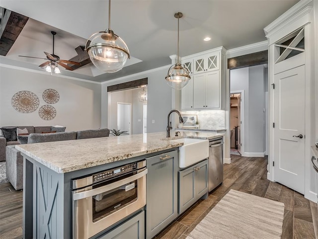4821 Hidalgo Ave, Mustang, OK 73064 - kitchen featuring stainless steel dishwasher, recessed lighting, a ceiling fan, decorative light fixtures, and white cabinetry