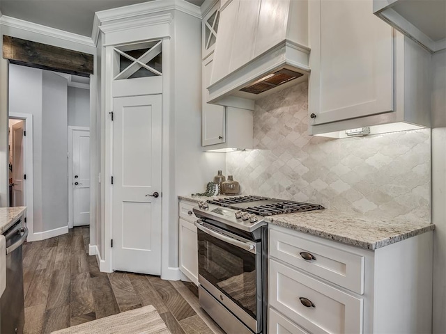4821 Hidalgo Ave, Mustang, OK 73064 - kitchen with stainless steel appliances, light stone counters, backsplash, white cabinets, and custom exhaust hood