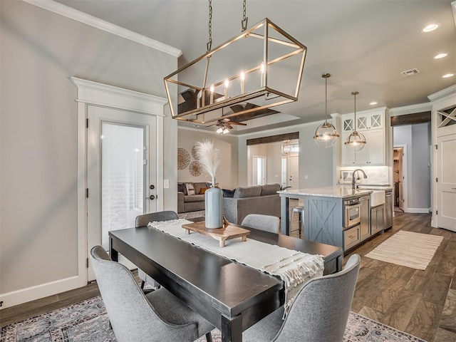 4821 Hidalgo Ave, Mustang, OK 73064 - dining room with recessed lighting, ornamental molding, ceiling fan, and dark wood-type flooring