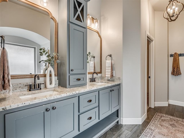 4821 Hidalgo Ave, Mustang, OK 73064 - bathroom with double vanity and wood finished floors