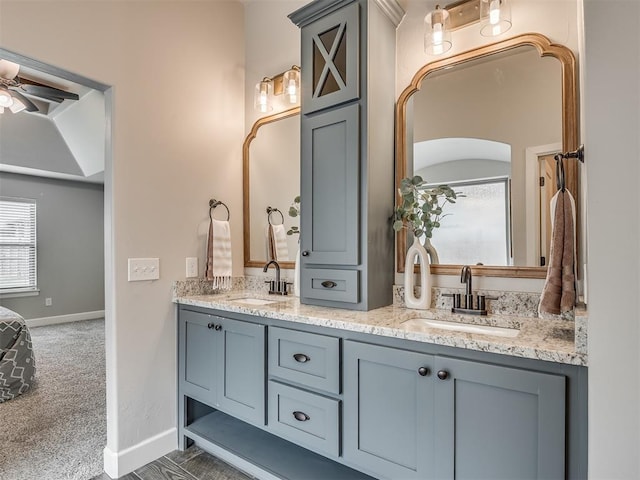 4821 Hidalgo Ave, Mustang, OK 73064 - bathroom with double vanity and a ceiling fan