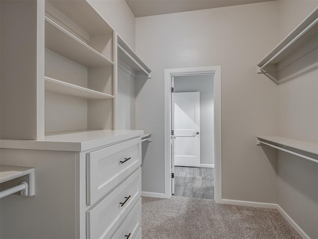 4821 Hidalgo Ave, Mustang, OK 73064 - walk in closet featuring light carpet
