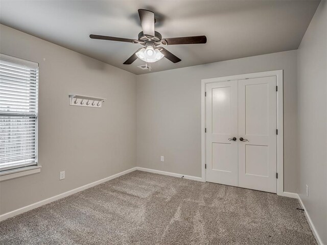 4821 Hidalgo Ave, Mustang, OK 73064 - unfurnished bedroom with carpet floors, a closet, and a ceiling fan