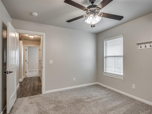 4821 Hidalgo Ave, Mustang, OK 73064 - spare room featuring dark colored carpet, a smoke detector, and a ceiling fan