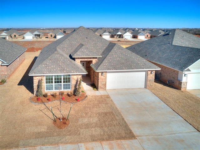 9313 NW 141st St, Yukon, OK 73099 - view of front of property featuring a shingled roof, a residential view, a garage, and concrete driveway