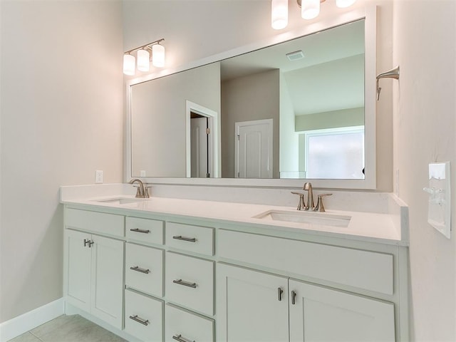9313 NW 141st St, Yukon, OK 73099 - bathroom with double vanity and baseboards