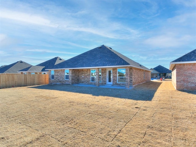 9313 NW 141st St, Yukon, OK 73099 - back of house with brick siding