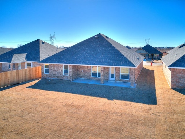 9313 NW 141st St, Yukon, OK 73099 - back of property with a patio area and a shingled roof