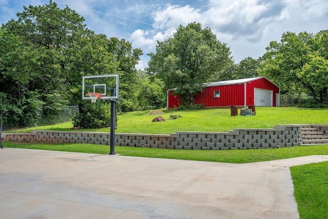 13848 Twin Ridge Dr, Edmond, OK 73034 - view of patio featuring a garage, an outdoor structure, basketball court, and a pole building