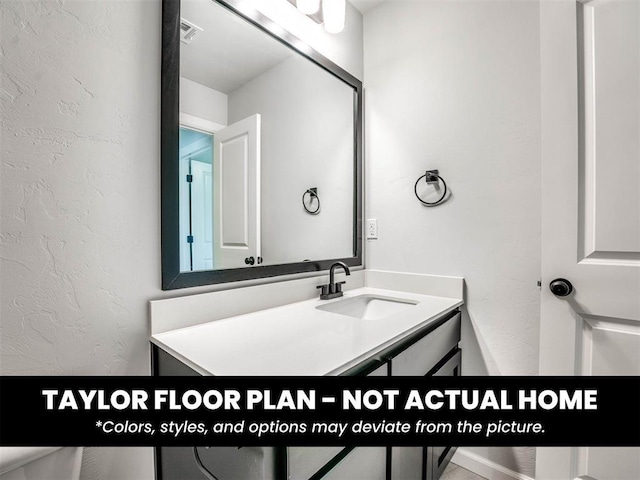 2508 Marsh Ln, Midwest City, OK 73130 - bathroom featuring vanity and a textured wall