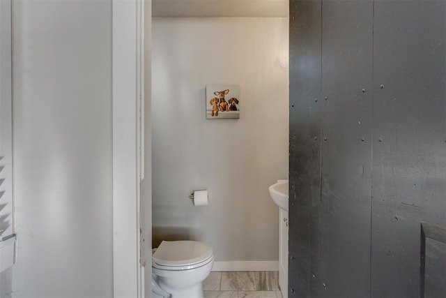 3424 NW 16th St, Oklahoma City, OK 73107 - bathroom with toilet and marble look tile flooring